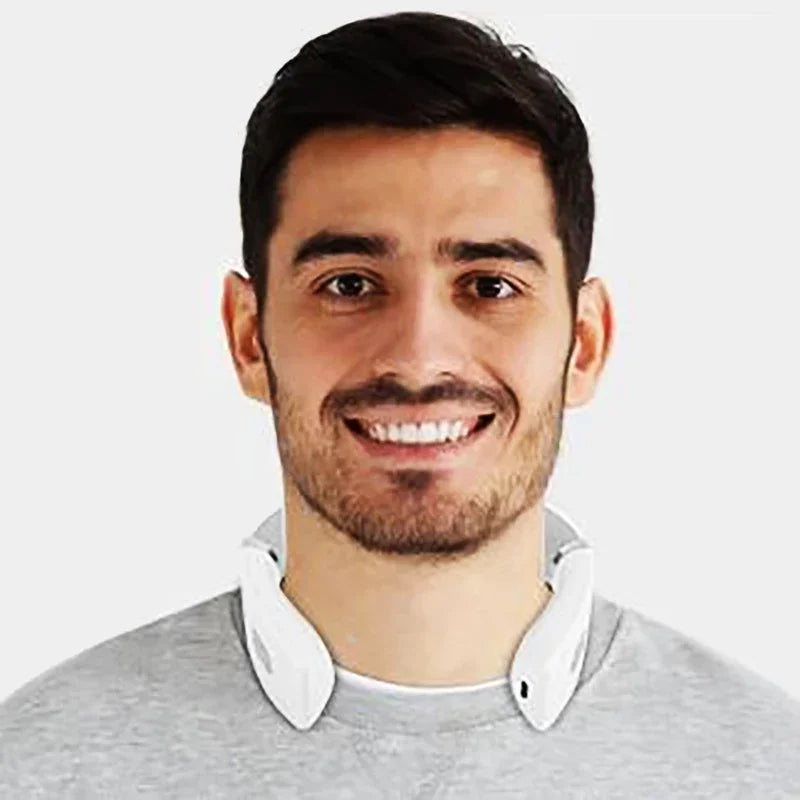 Smiling man wearing a white USB rechargeable neck massager around his neck
