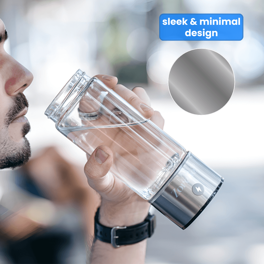 Man drinking from Zorelie sleek portable hydrogen water bottle with transparent body and metallic base