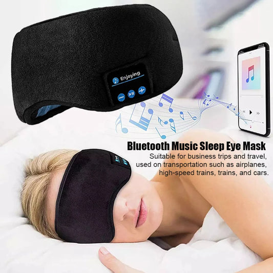 Bluetooth sleep headphones with eye mask in black worn by woman resting with music playing from smartphone