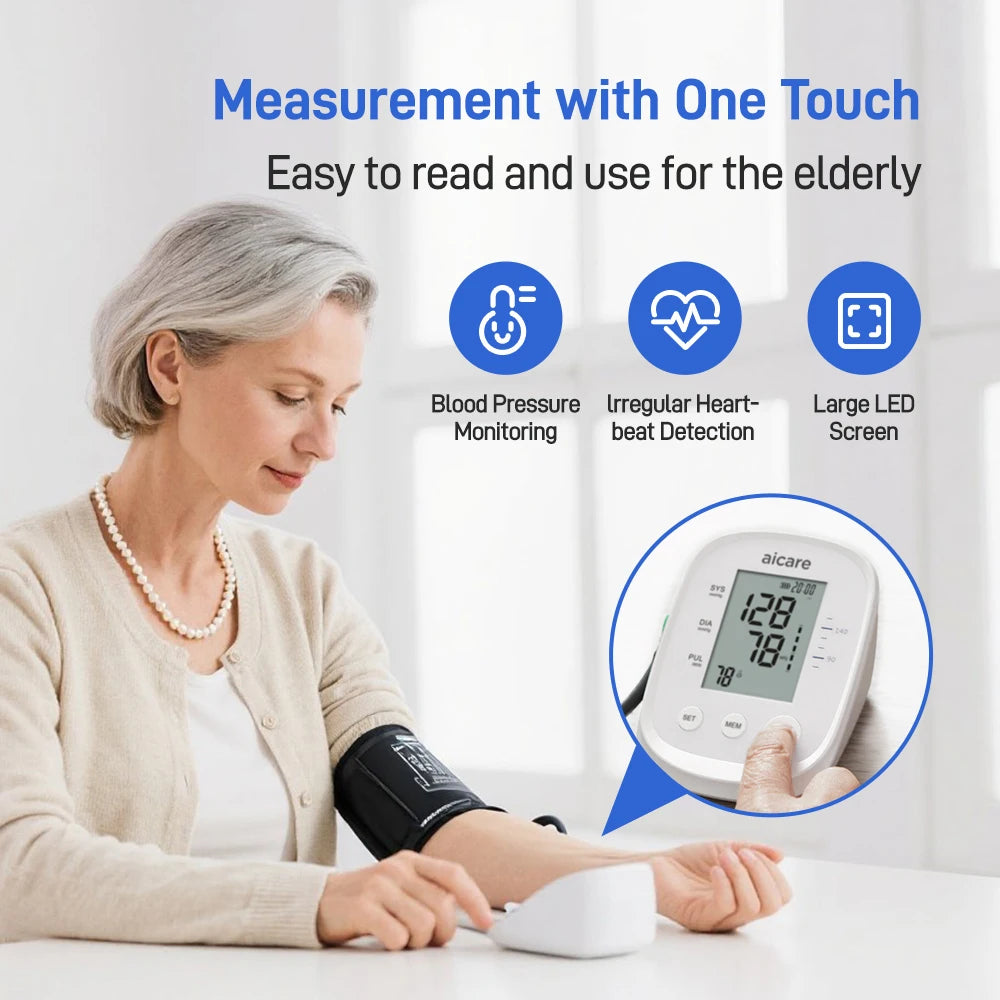 Automatic upper arm blood pressure monitor with large LED screen being used by elderly woman for easy blood pressure monitoring