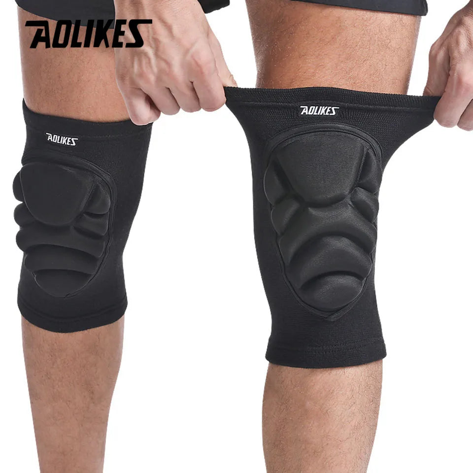 Black cushioned sports knee pads for joint support worn on knees with flexible stretch design