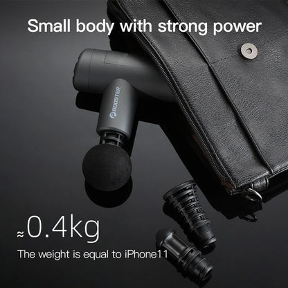 Compact mini percussion massage gun in black with multiple attachments next to a black leather bag