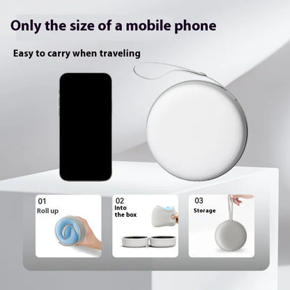 Compact memory foam neck support pillow rolled and stored in a small travel case the size of a mobile phone