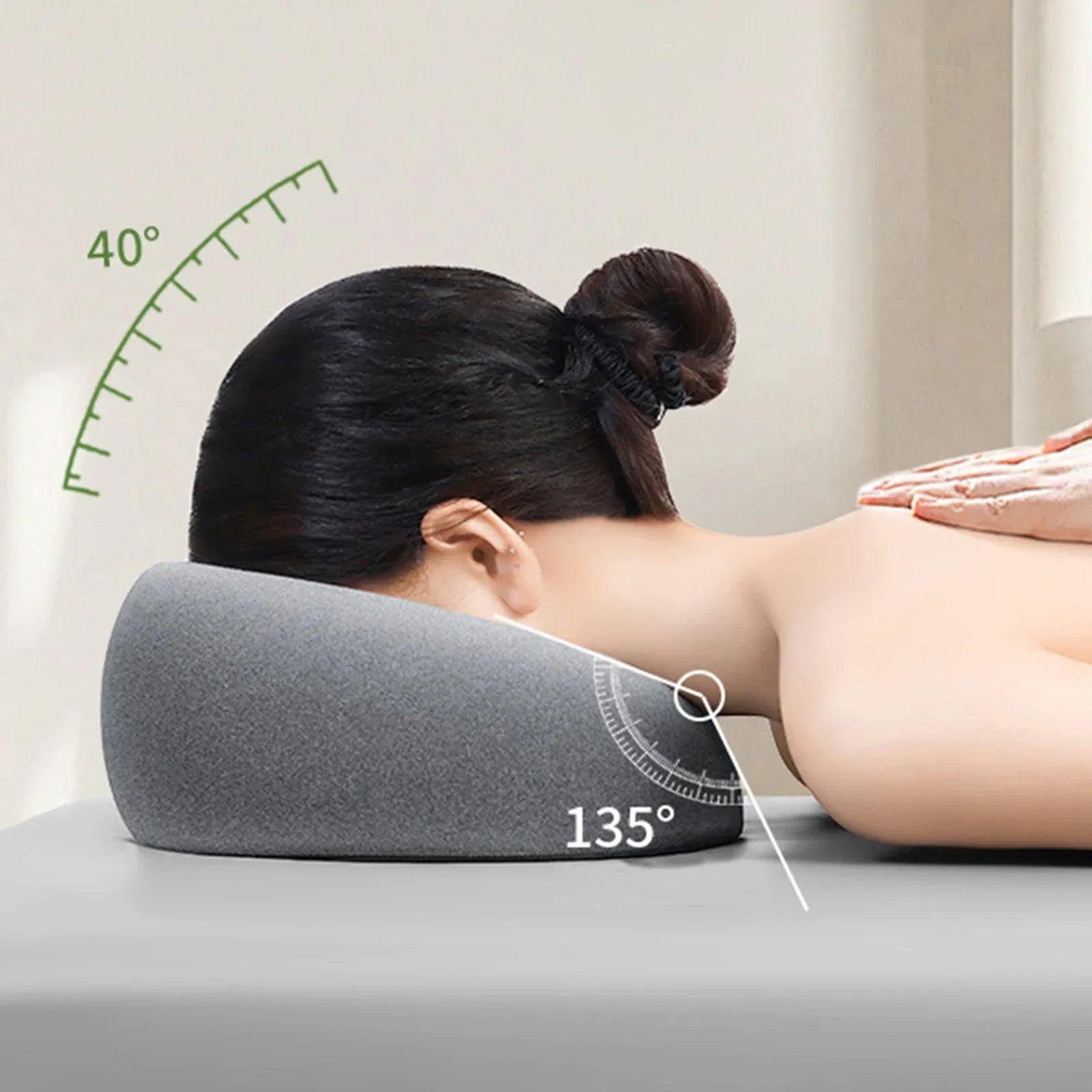 Ergonomic memory foam headrest in gray supporting neck and head at a 135 degree angle for comfort