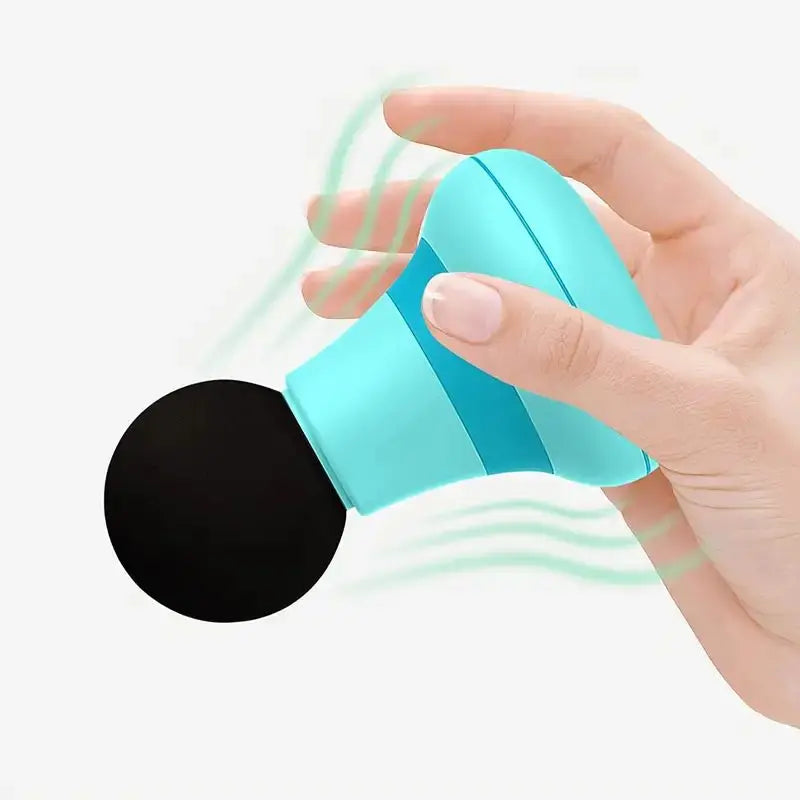 Hand holding a blue handheld mini muscle massage gun with black massage head in use