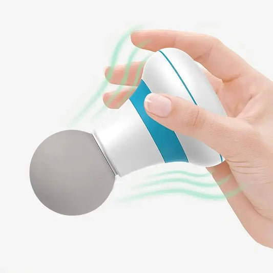 Hand holding a handheld mini muscle massage gun with a round massage head in white and blue