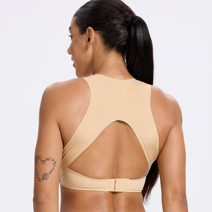 Back view of a woman wearing a beige posture corrector bra for women with a racerback design