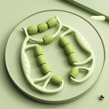 Green leg slimming massager for thighs and calves with textured rollers on a plate