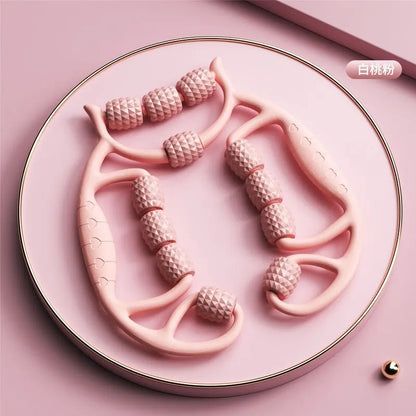 Pink leg slimming massager for thighs and calves with textured rollers on a plate