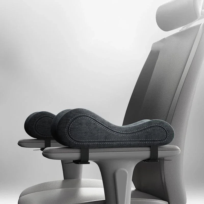Gray memory foam armrest pads attached to office chair armrests for enhanced comfort