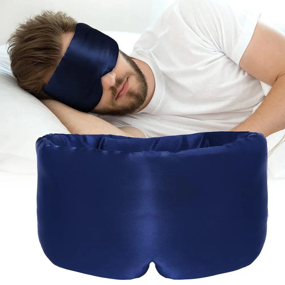 Zorelie.co navy blue mulberry silk sleep mask worn by man sleeping comfortably on pillow