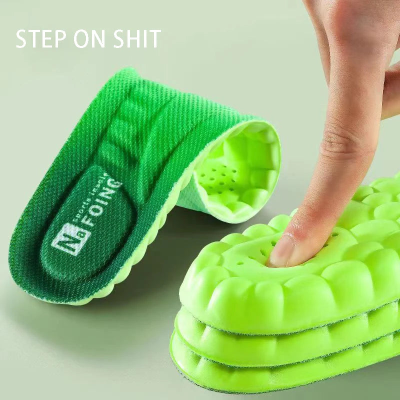 Green orthopedic sport insoles for foot pain with cushioned textured surface showing finger pressing down