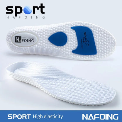 White shock absorbing insoles for running with blue cushioning pads and textured surface