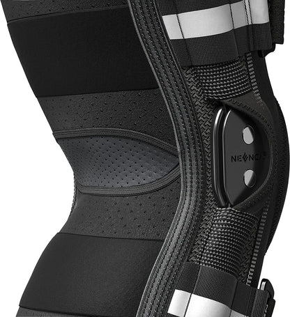 Close-up of black hinged knee brace for pain relief with adjustable straps and breathable fabric