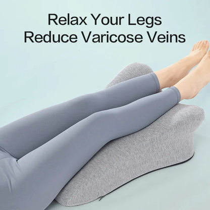 Gray leg elevation pillow supporting legs to relax and reduce varicose veins for pain relief