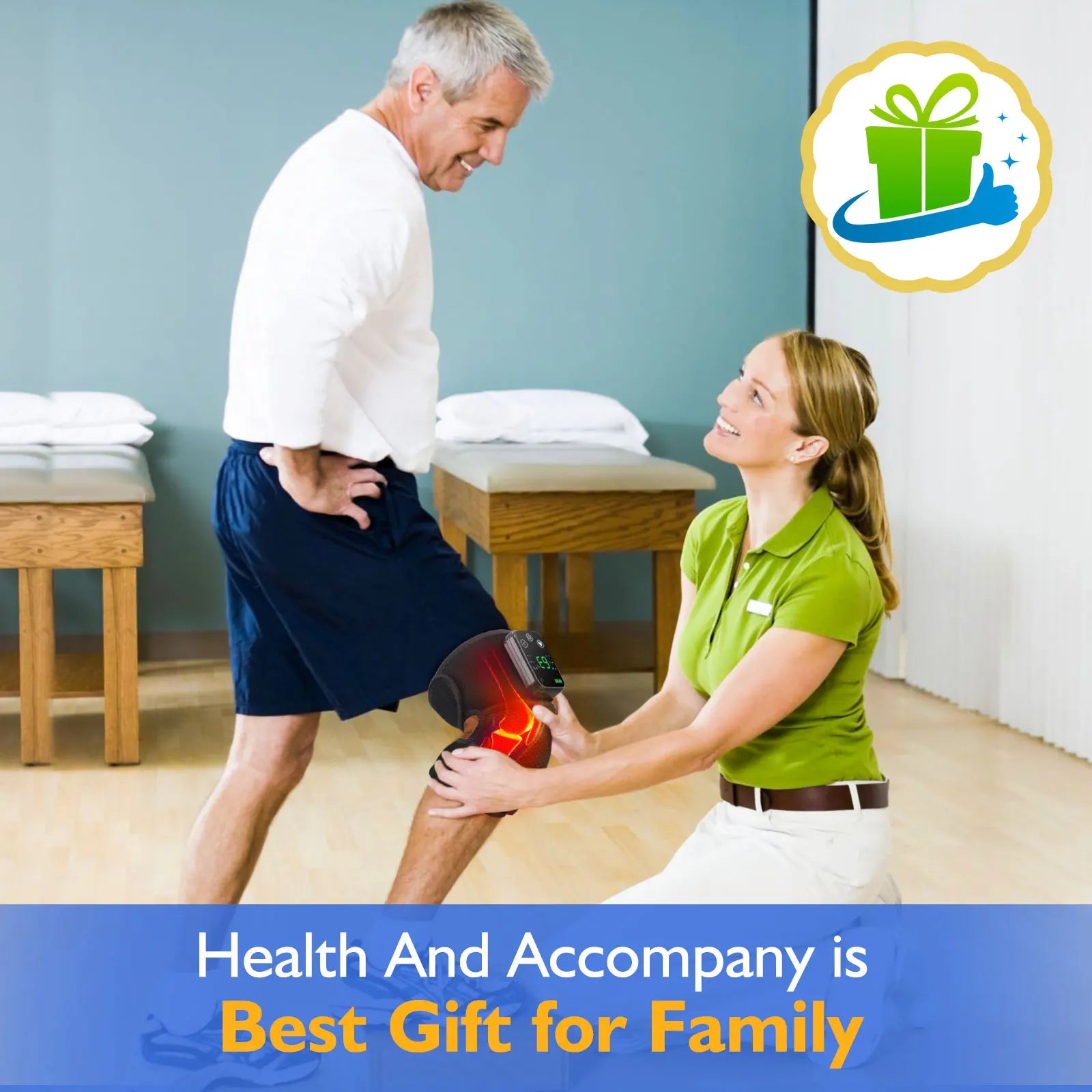 Man using rechargeable heated knee massager on knee while female therapist assists indoors
