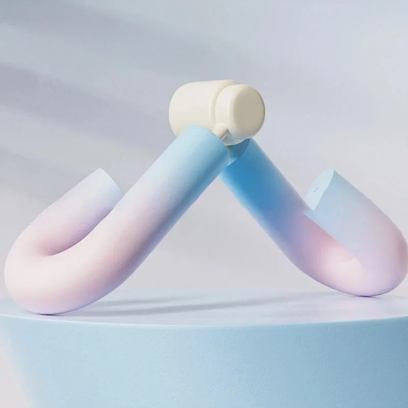 Pastel pink and blue thigh master leg exerciser with comfortable foam handles for effective leg workouts