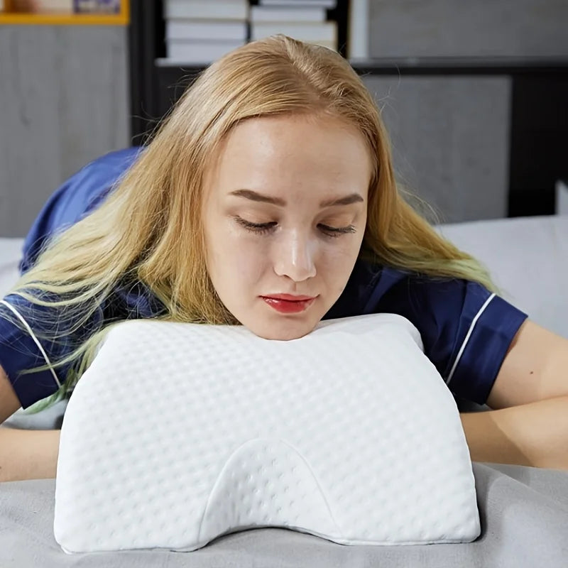 Woman resting face on a slow rebound memory foam pillow with textured white cover