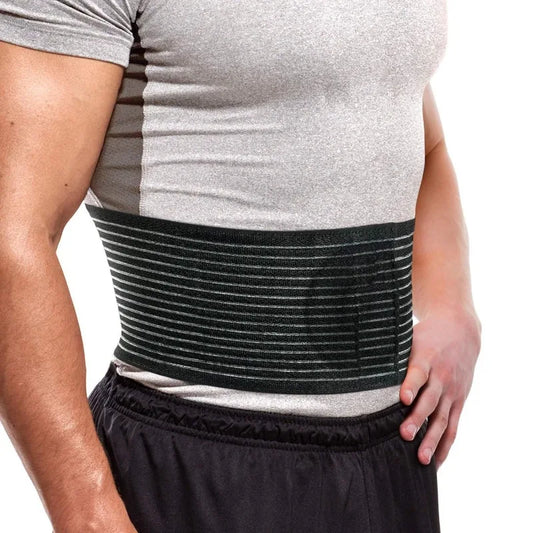 Zorelie.co black umbilical hernia belt for men and women worn on torso with gray shirt and black shorts