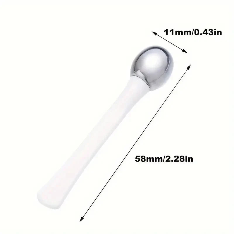 Zorelie.co under eye roller massage stick with metal tip and white handle measuring 58mm length