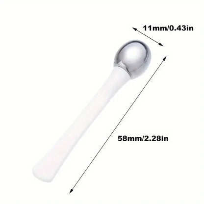 Zorelie.co under eye roller massage stick with metal tip and white handle measuring 58mm length