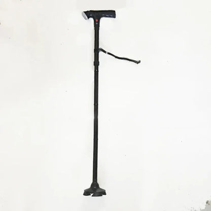 Black collapsible folding walking cane with ergonomic handle and wrist strap for easy mobility